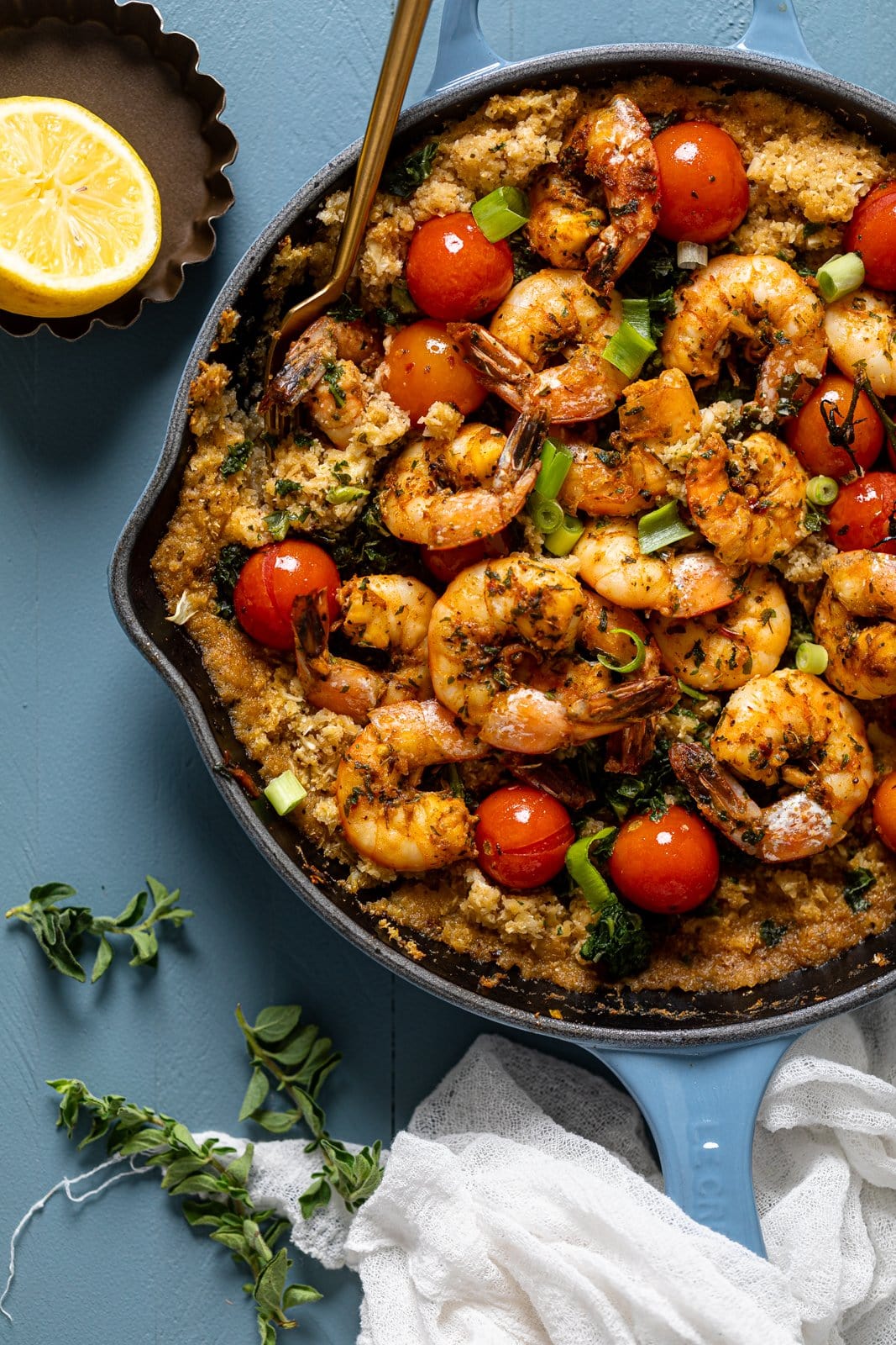 Overhead shot of a pan of Spicy Cajun Shrimp, Kale. The perfect weeknight dinner.