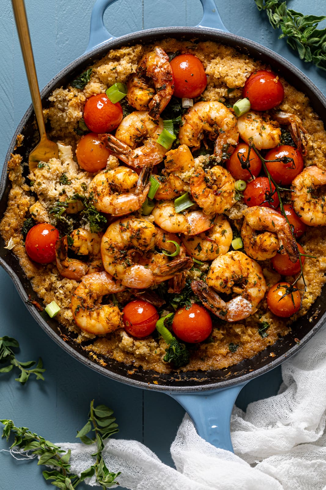 Closeup of a skillet of Spicy Cajun Shrimp, Kale, and Cauliflower Rice