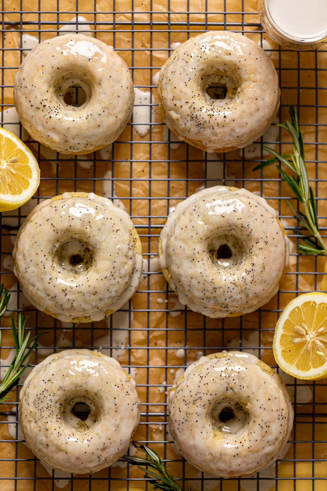 Vegan Lemon Poppy Seed Donuts on a wire rack