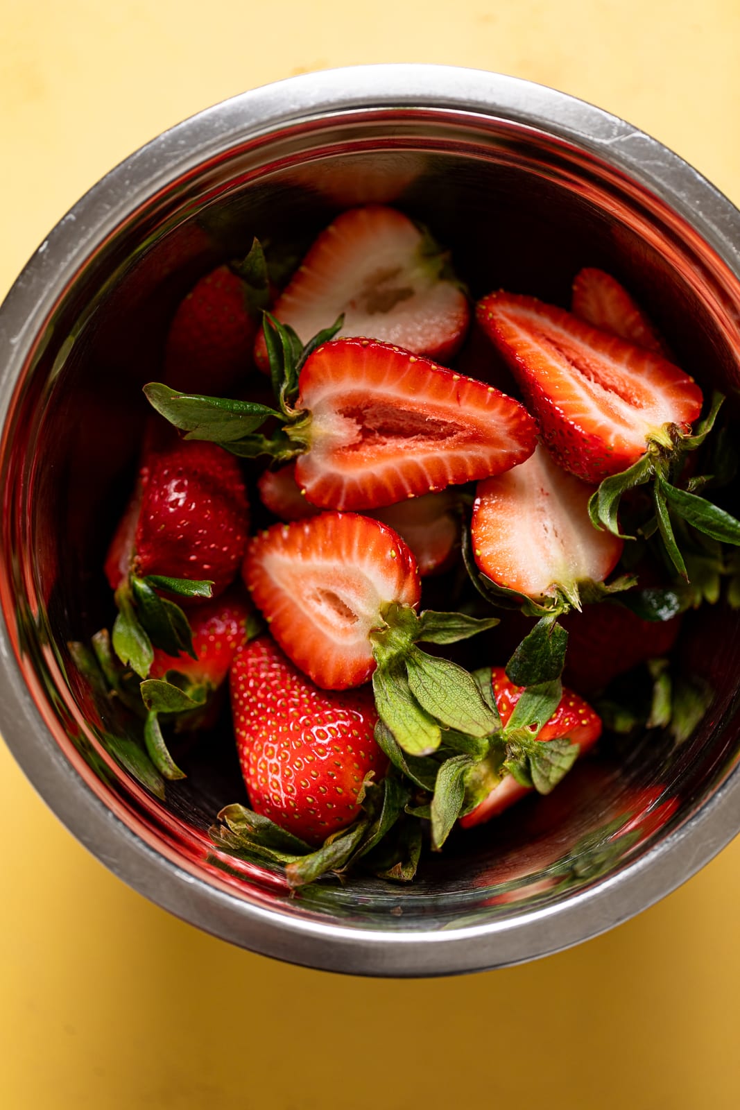 Bowl of halved strawberries