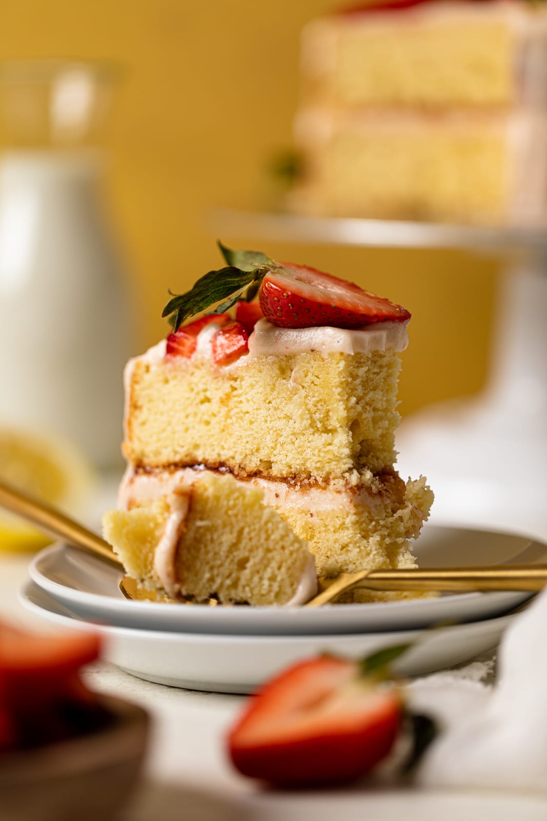 Slice of Strawberry Cake on two small stacked plates