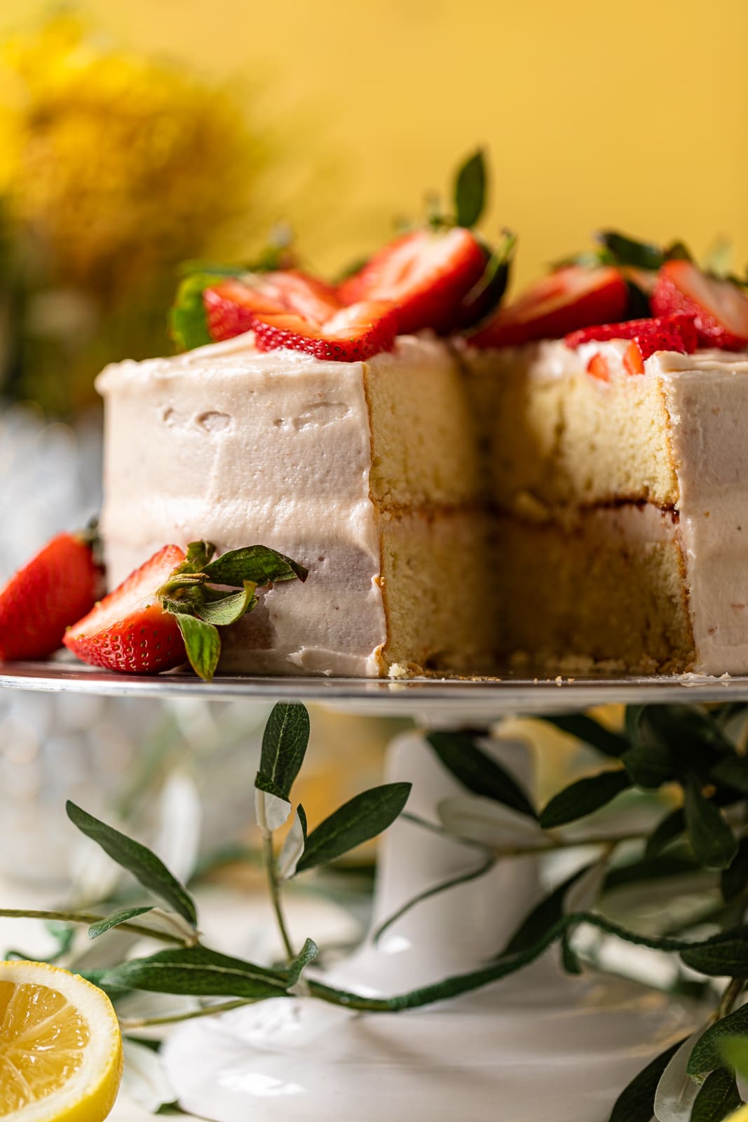 Lemon Strawberry Layer Cake missing a slice