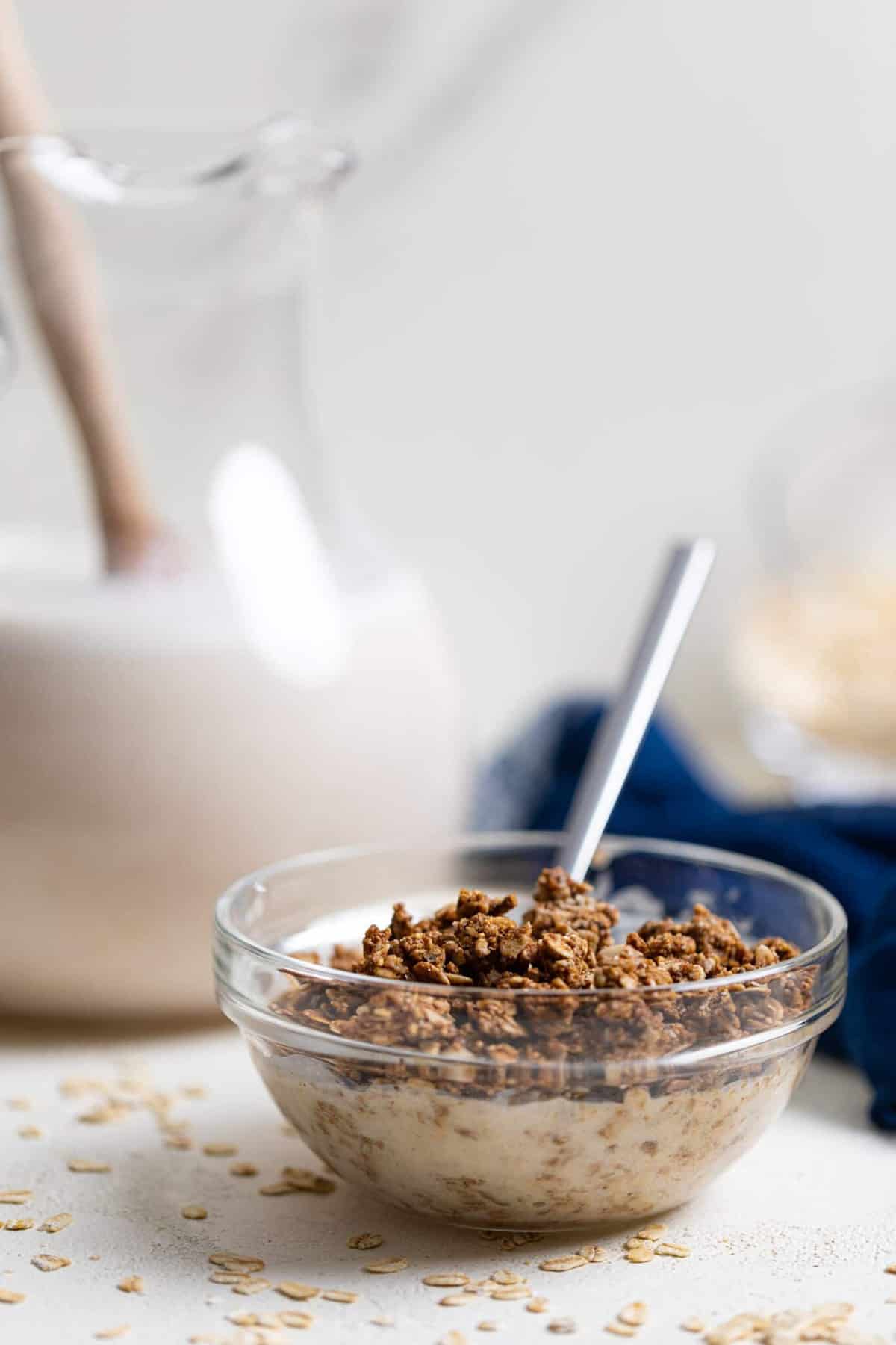 Bowl of granola and Creamy Homemade Oat Milk.