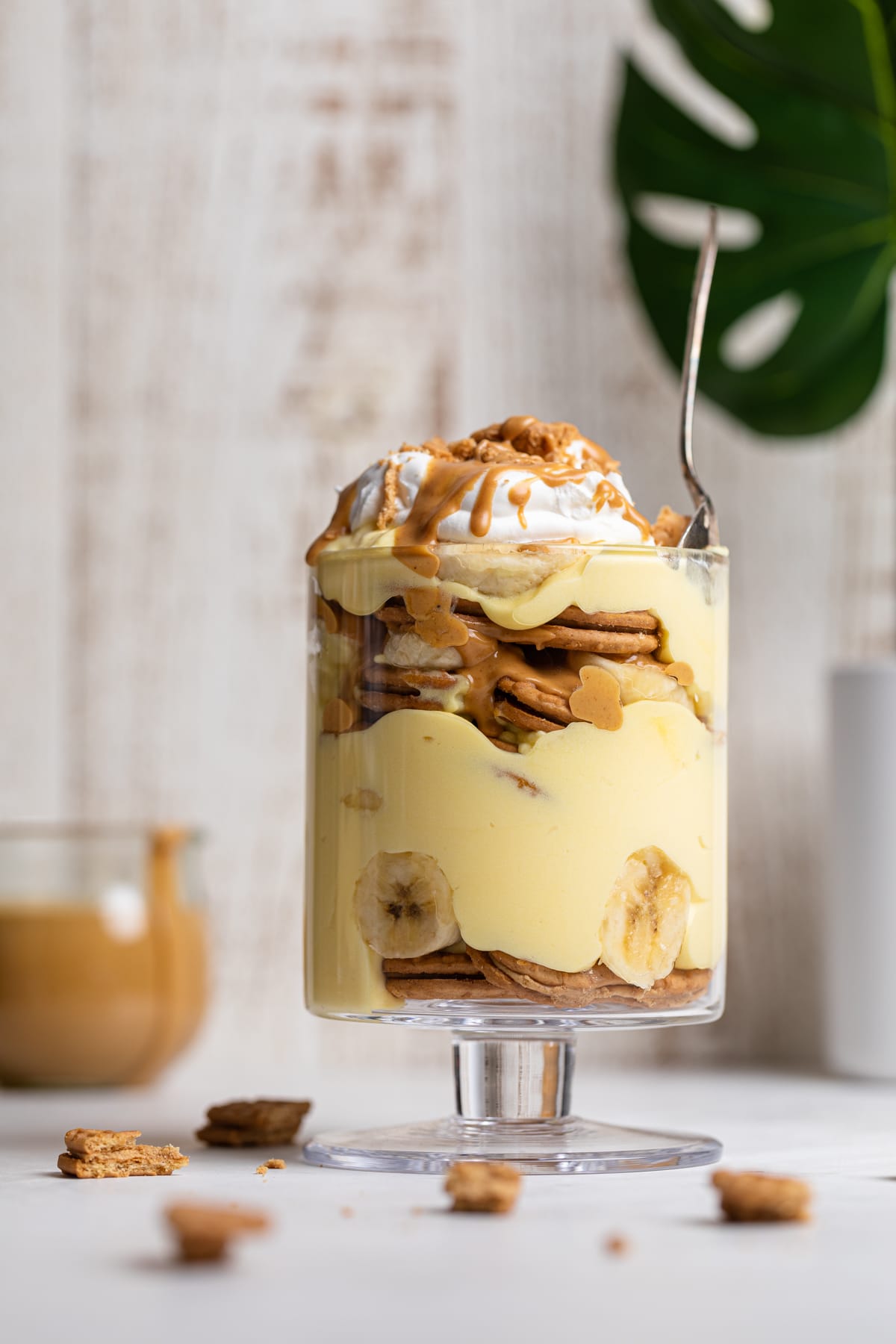 Spoon in a glass of Peanut Butter Banana Pudding.