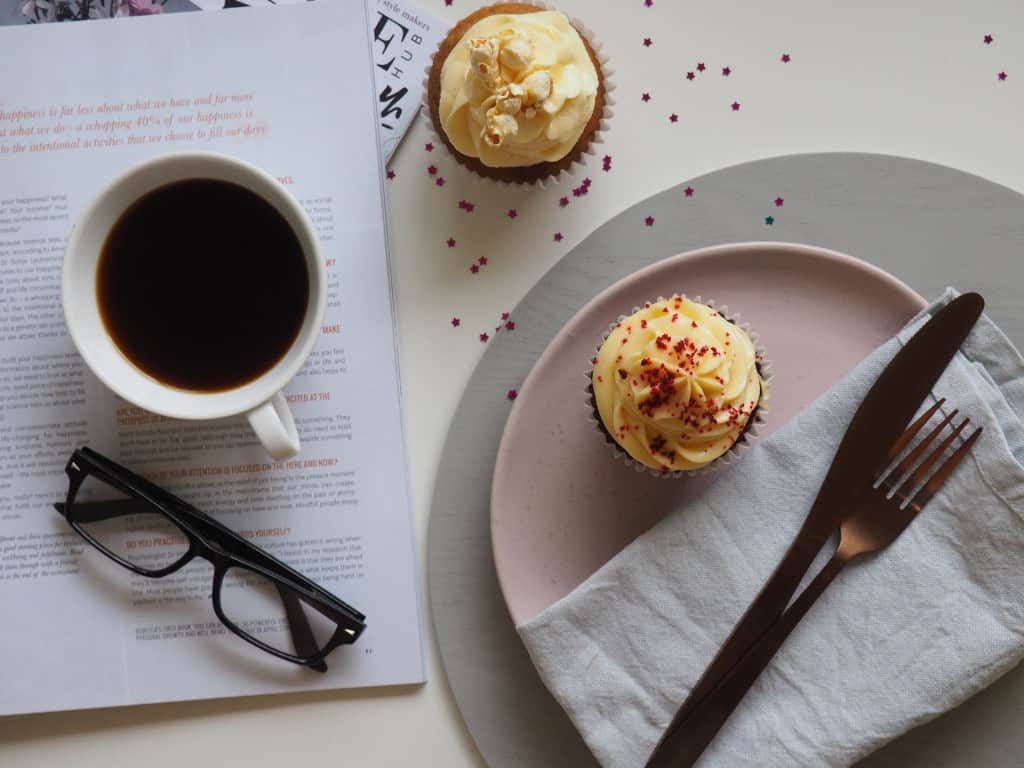 Cupcakes on a plate and a table.