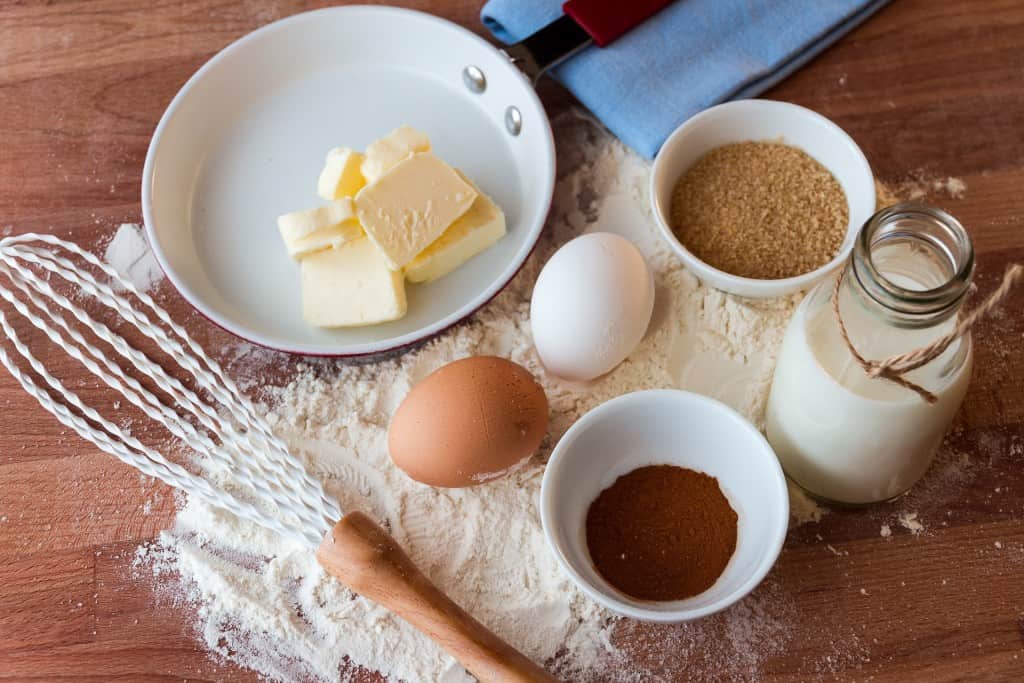Eggs, butter, and other ingredients on a counter.