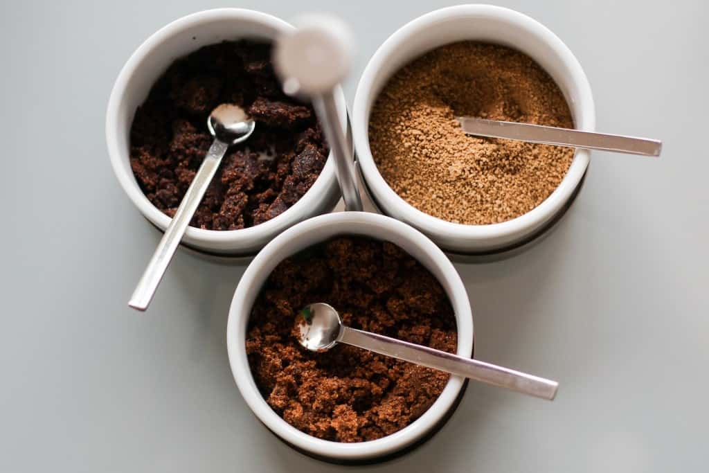 Spoons in bowls of sugar.