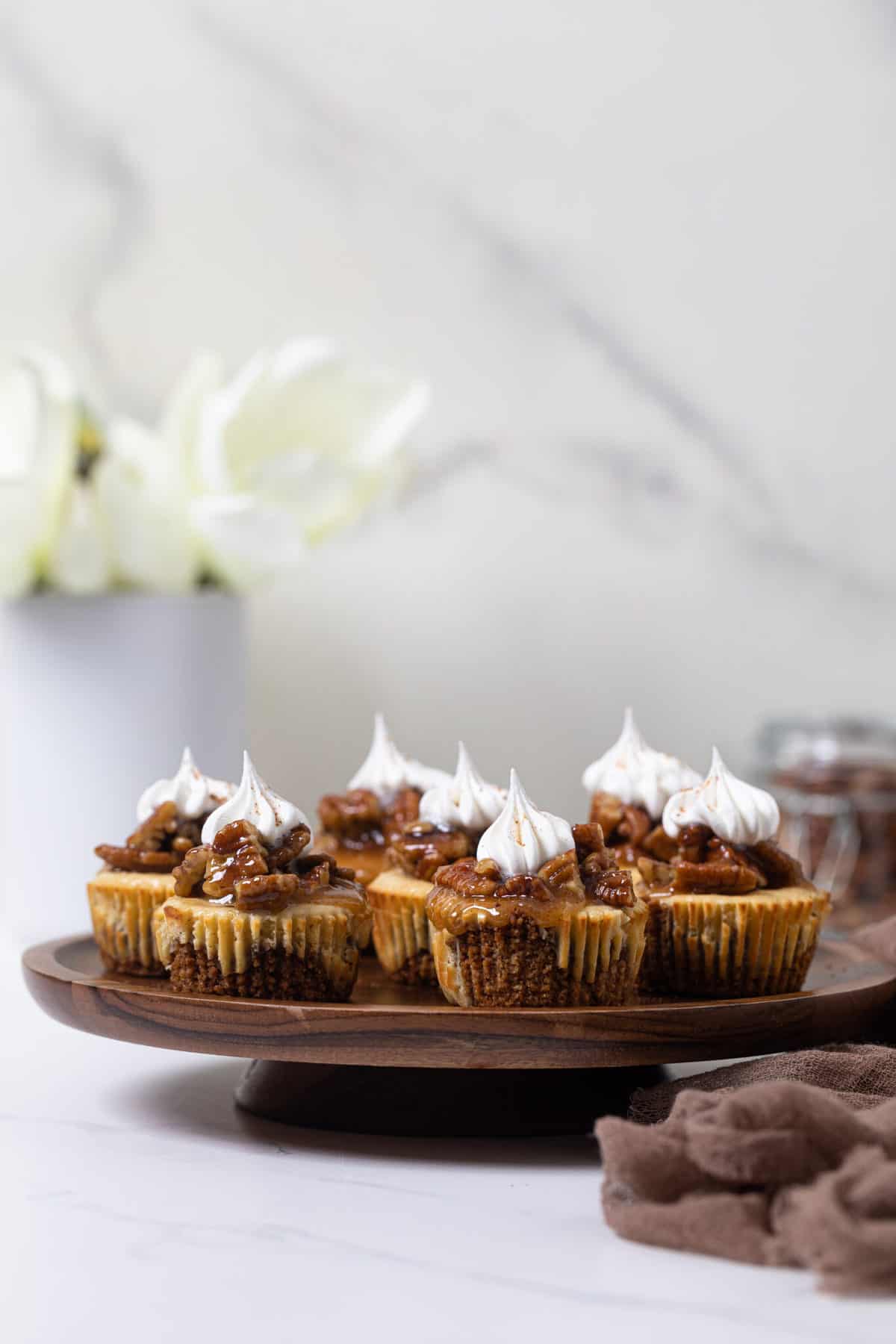 Pecan Pie Cheesecake Bites on an elevated platter.