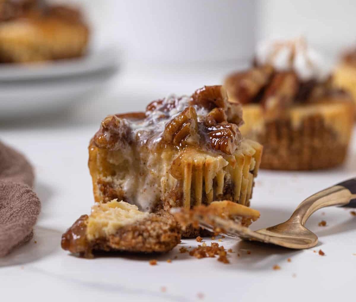 Pecan Pie Cheesecake Bites next to a fork.