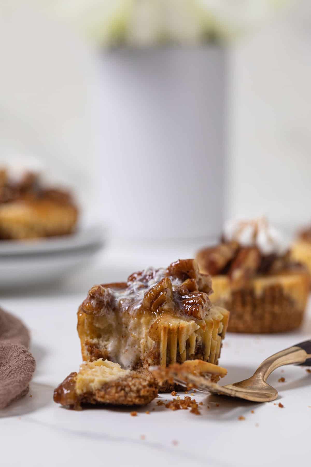 Pecan Pie Cheesecake Bites next to a fork.