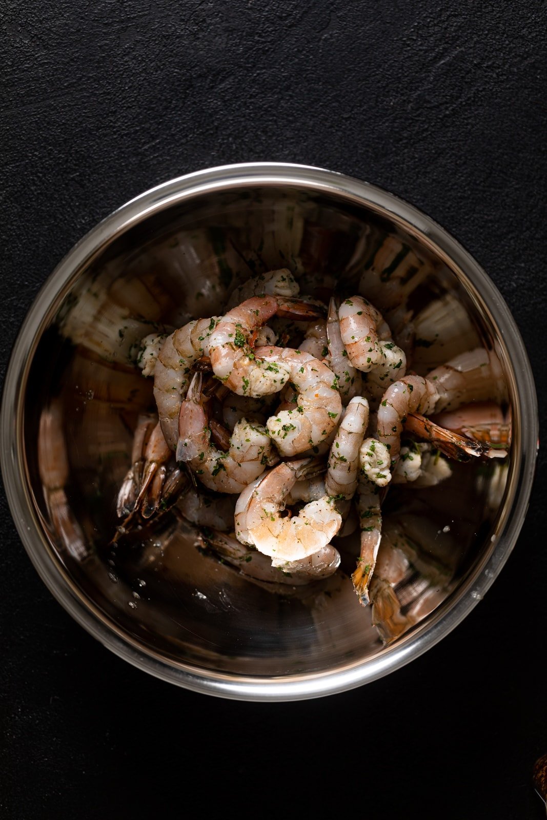 Raw, seasoned shrimp in a bowl
