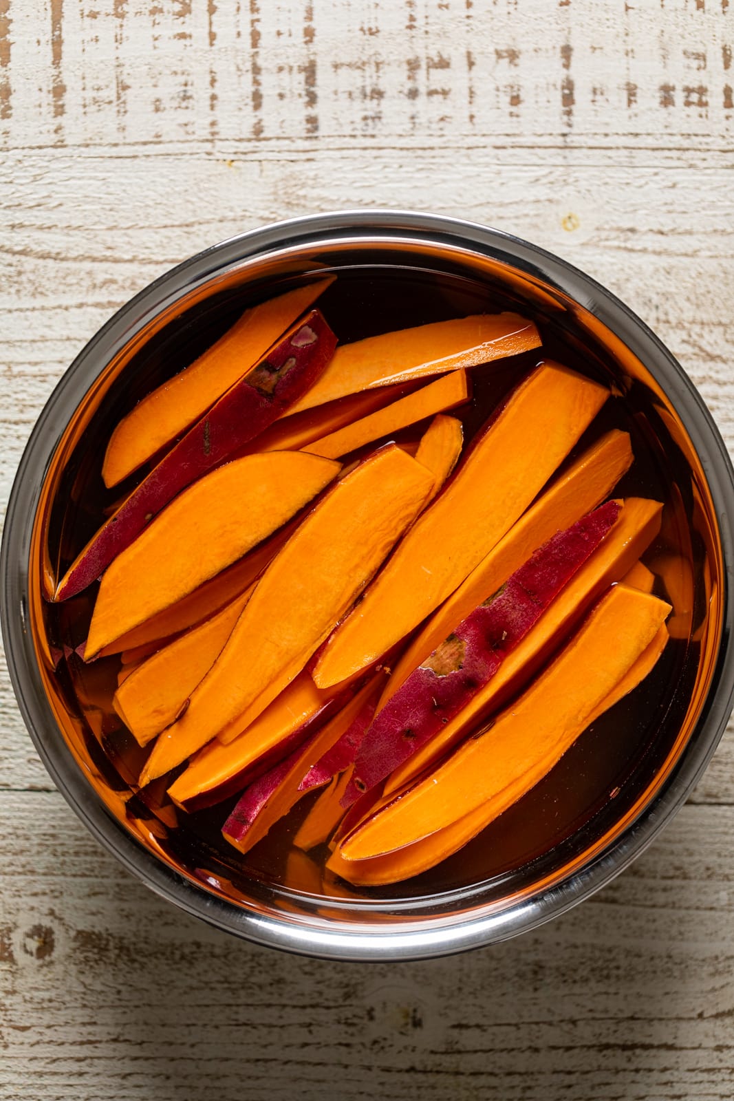 Bowl of Sweet Potato Wedges in water