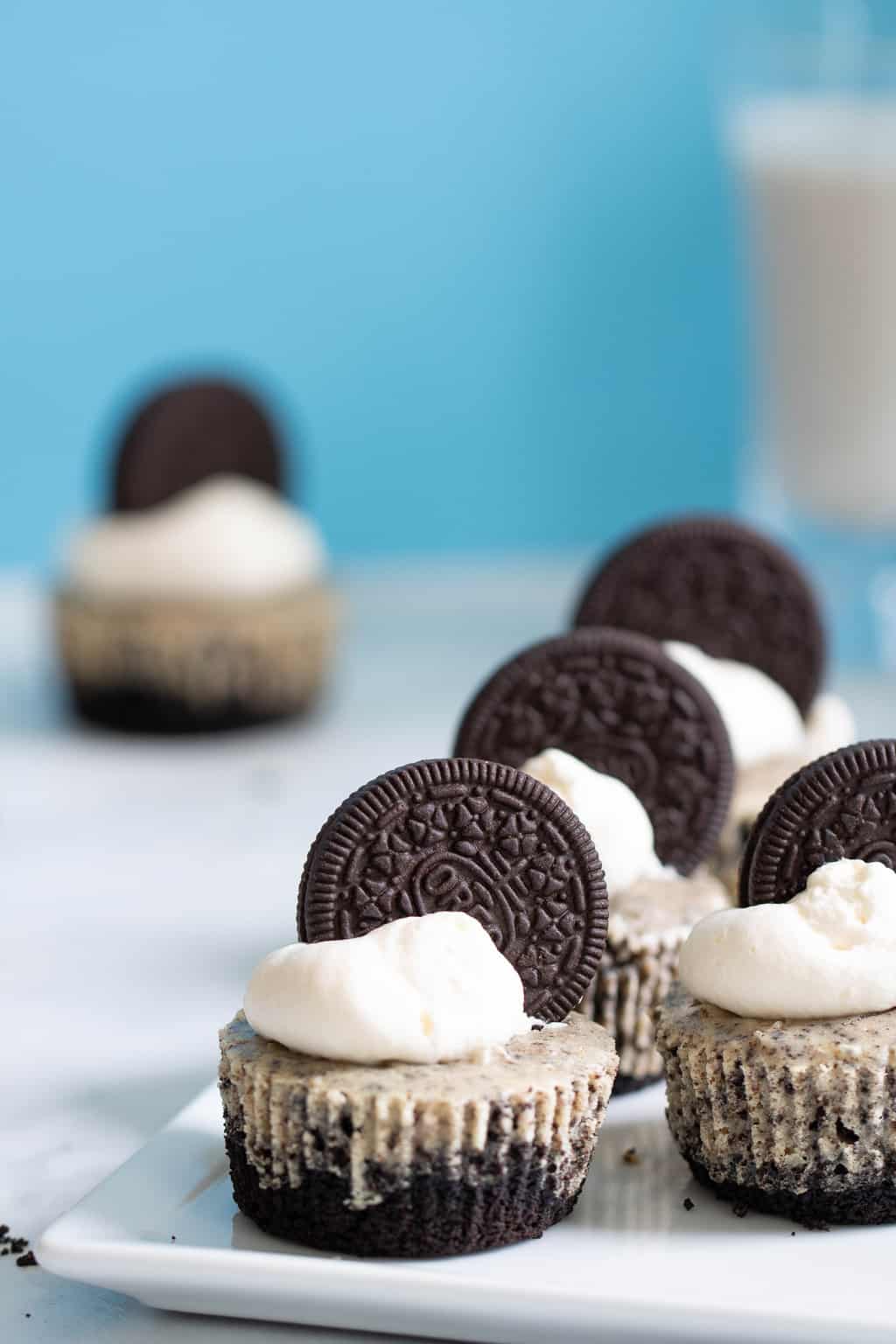Oreo Cheesecake Bites lined on a plate.