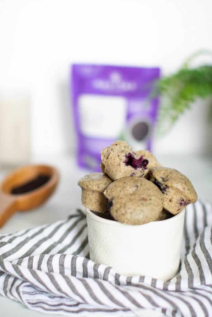 Overflowing bowl of Vegan Blueberry Acai Mini Muffins.