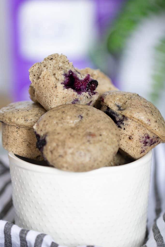 Overflowing bowl of Vegan Blueberry Acai Mini Muffins.