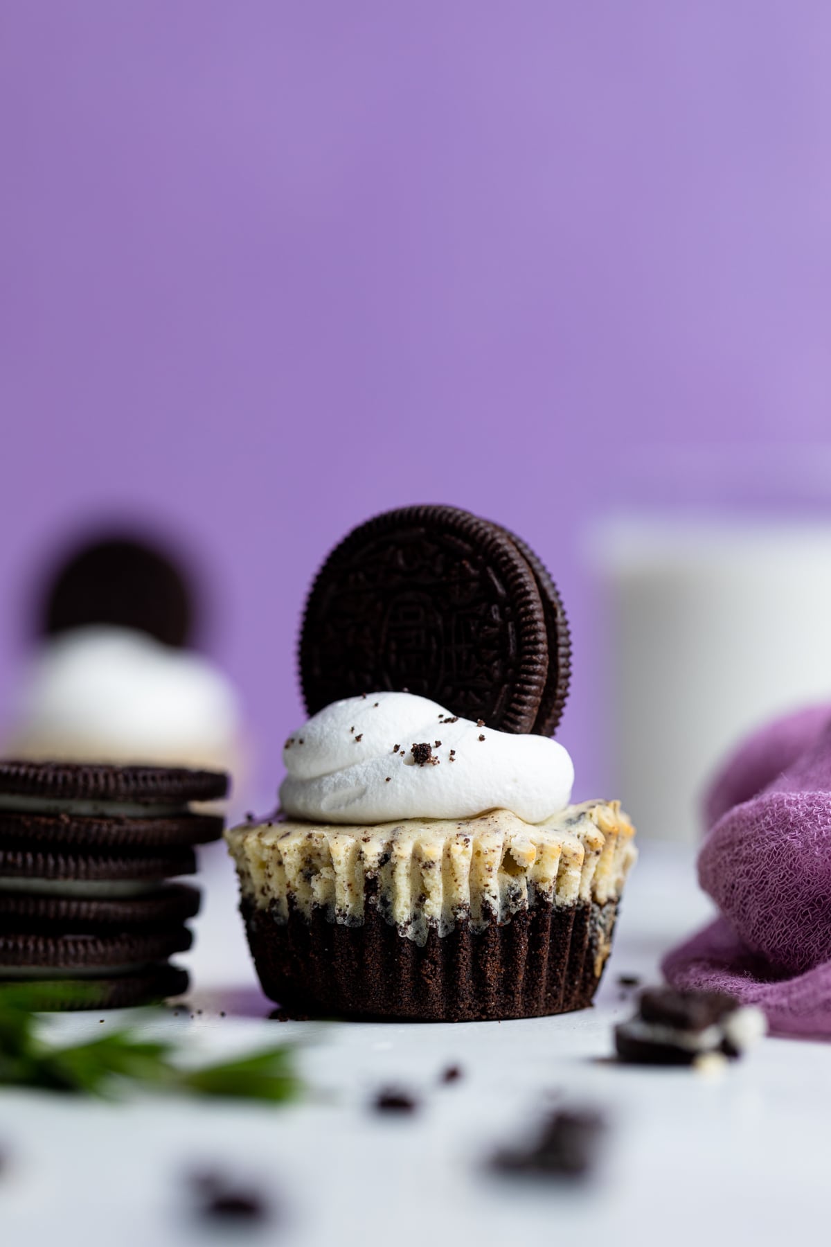 Oreo Cheesecake Bite next to a stack of Oreos.