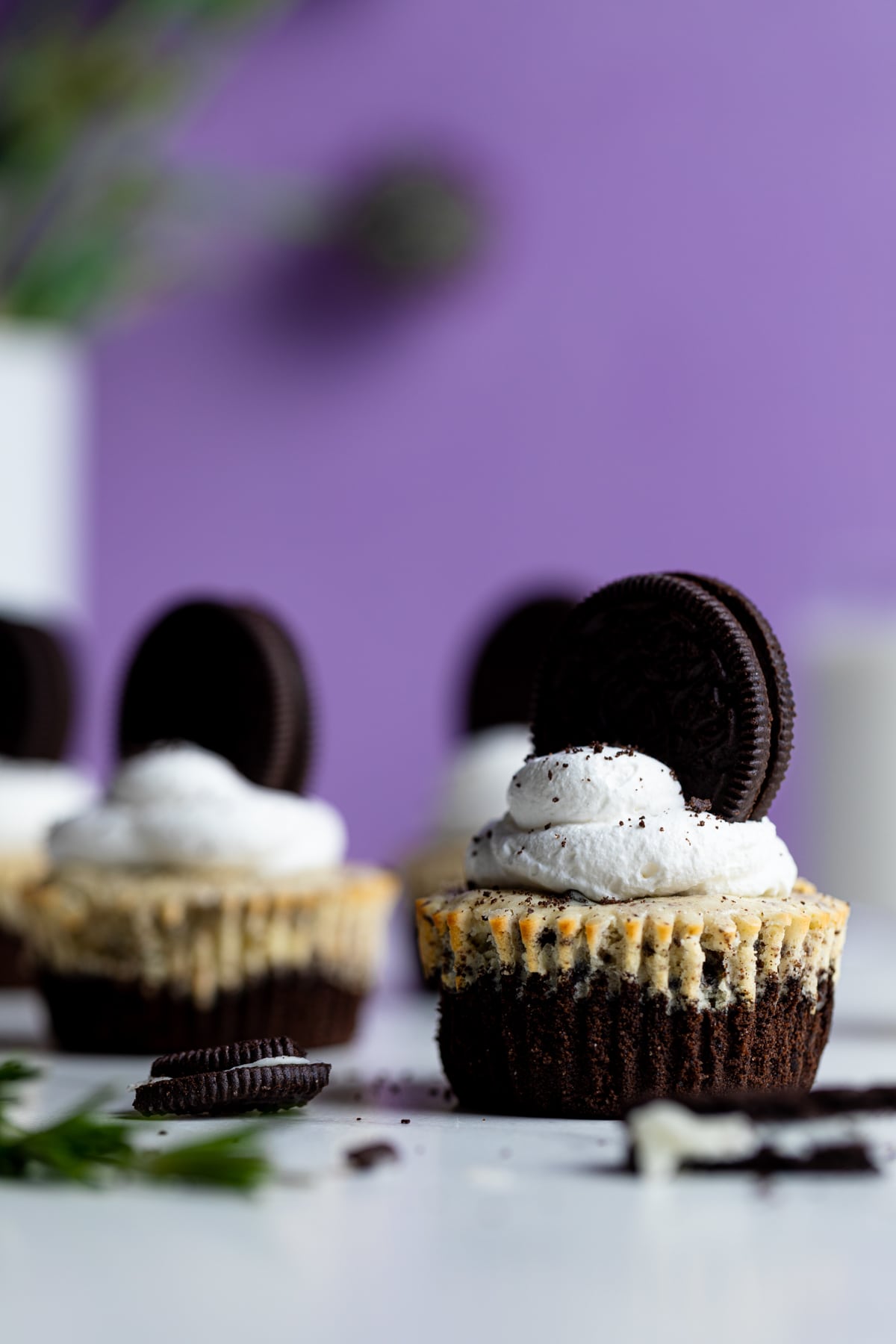 Oreo Cheesecake Bites topped with whipped cream and Oreos.