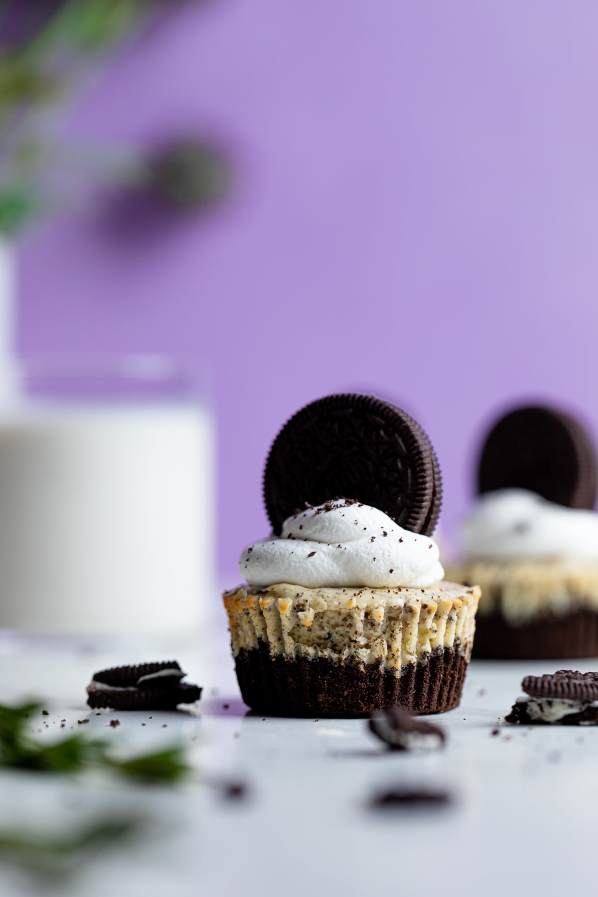 Oreo Cheesecake Bites with a glass of milk.