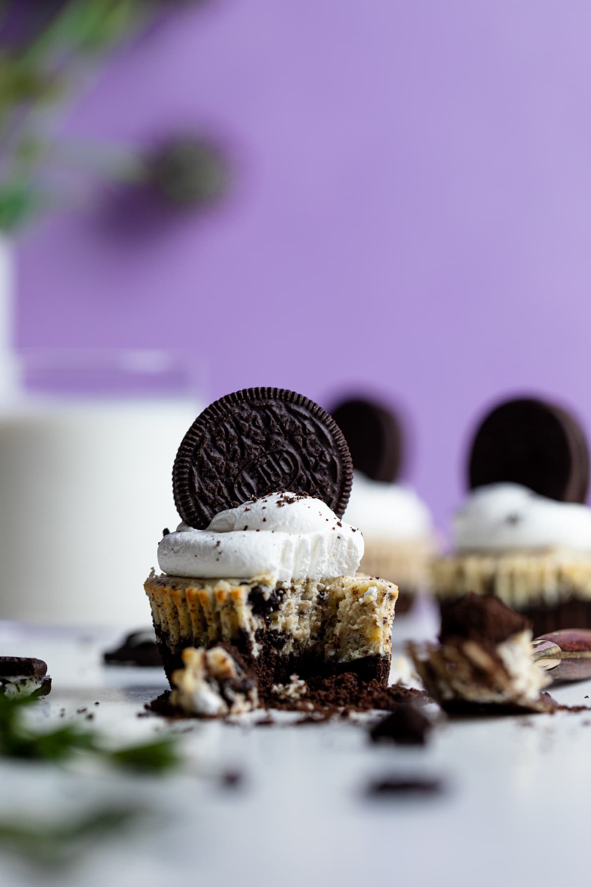 Oreo Cheesecake Bites, one of which is missing a bite.