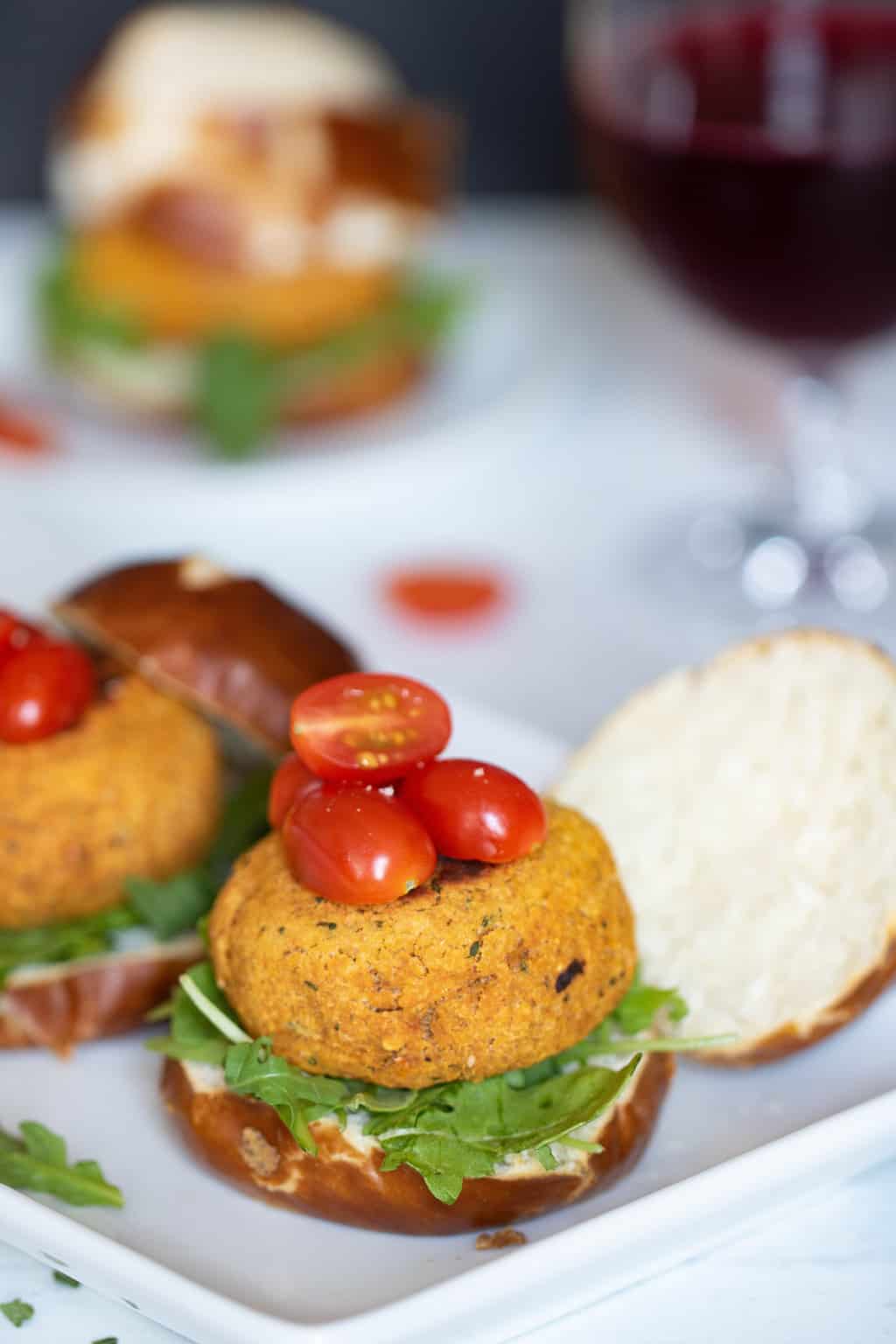 Chickpea Sweet Potato Sliders with Aioli lined on a white plate.