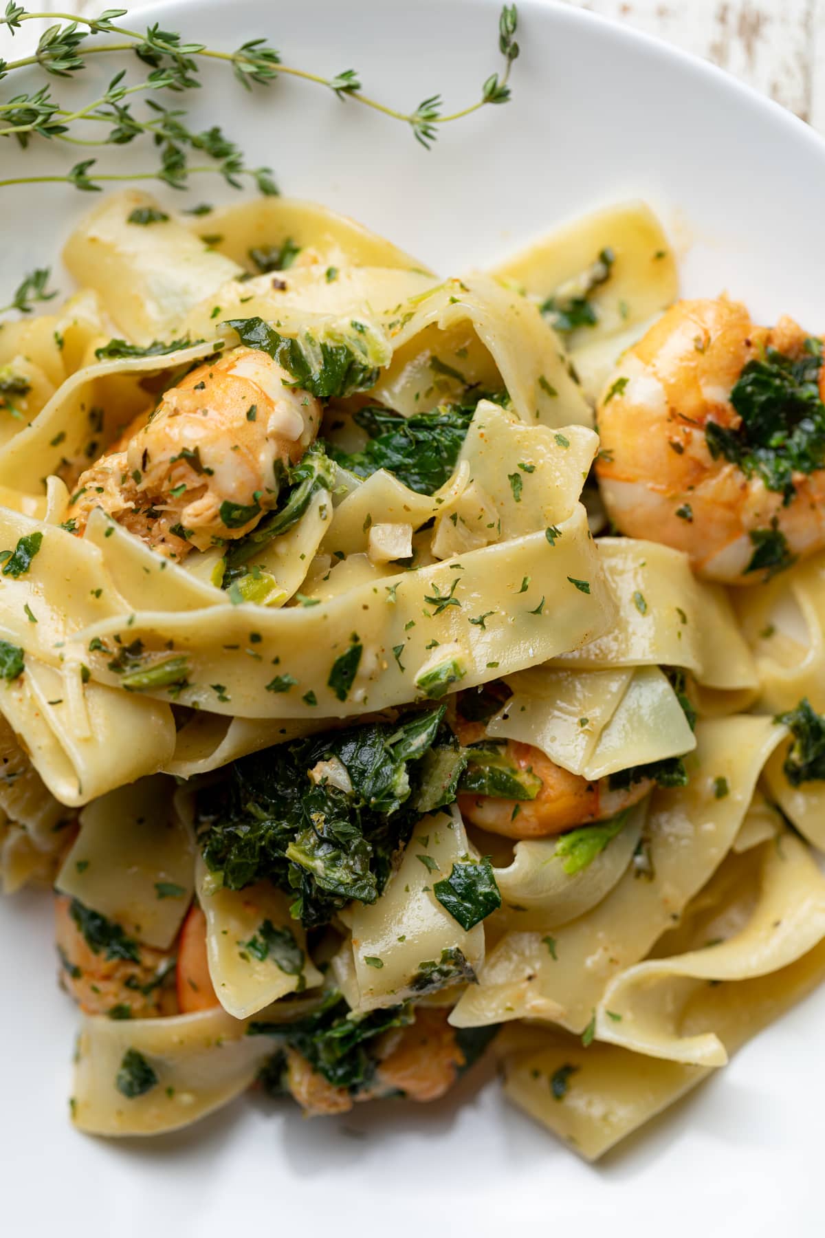 Savory Lemon Garlic Shrimp Pasta on a white plate.