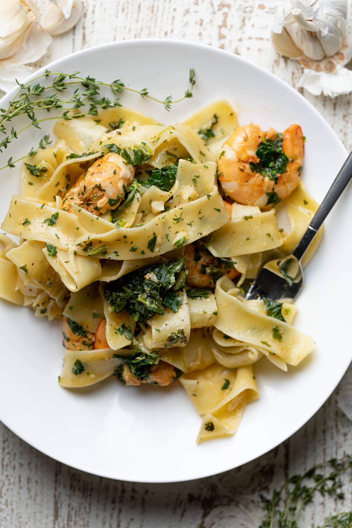 Fork on a plate with Savory Lemon Garlic Shrimp Pasta.