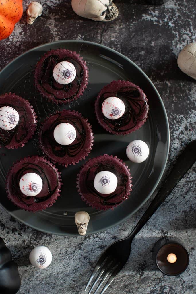 Eyeballs on top of Halloween Graveyard Cheesecake Bites.