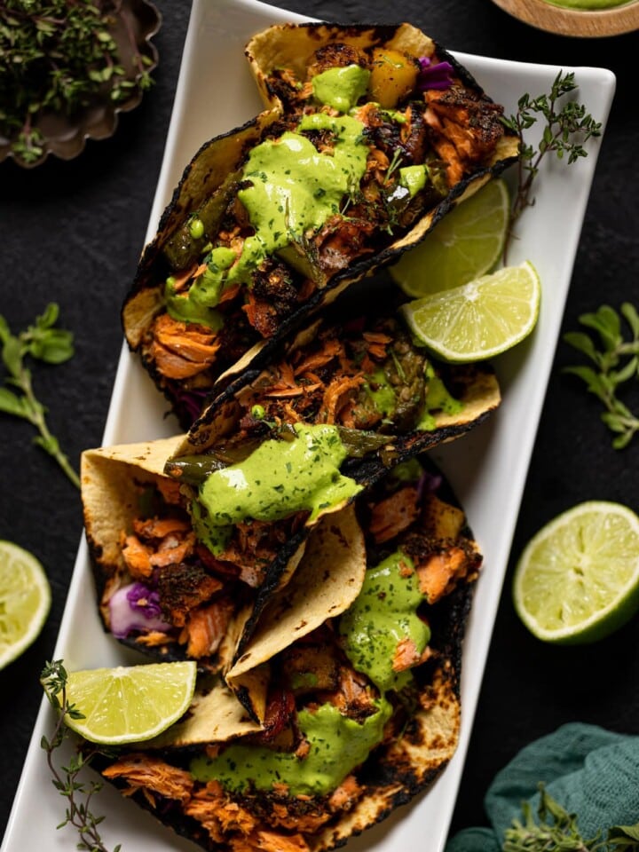 Overhead shot of Jerk Salmon Tacos with Avocado Cilantro Lime Sauce