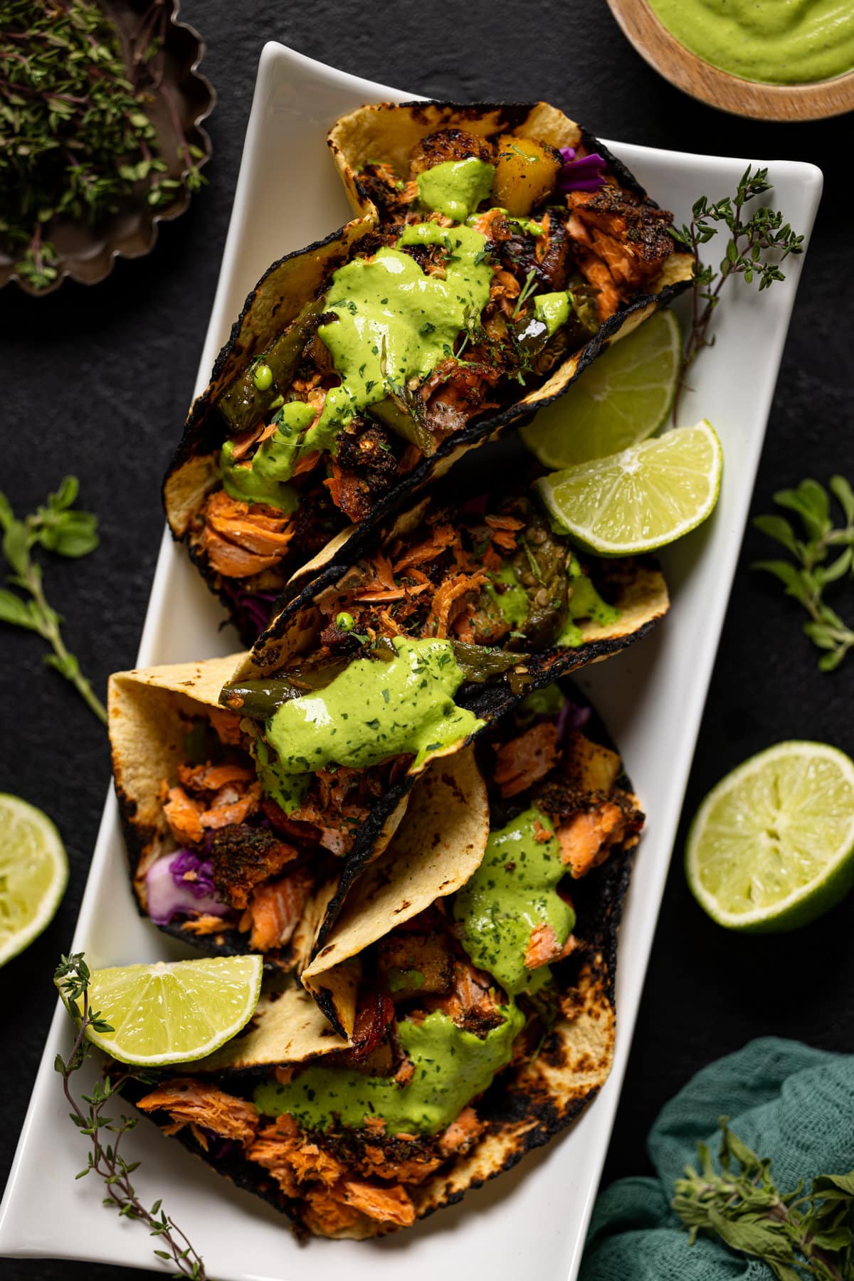 Overhead shot of Jerk Salmon Tacos with Avocado Cilantro Lime Sauce. A perfect easy weeknight dinner.