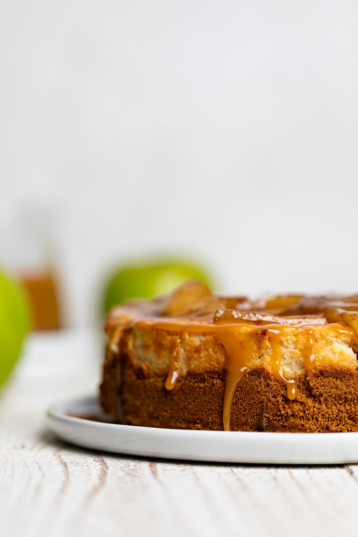 Caramel Apple Spice Cheesecake on a white plate.