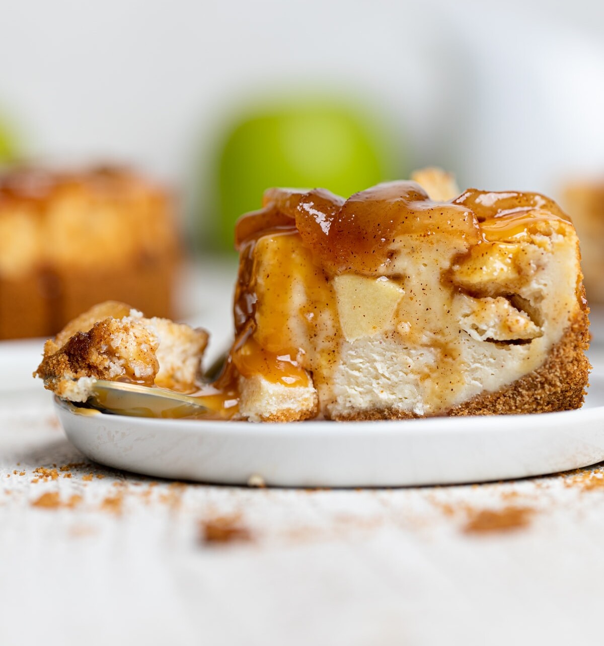 Slice of Caramel Apple Spice Cheesecake with the end cut off.