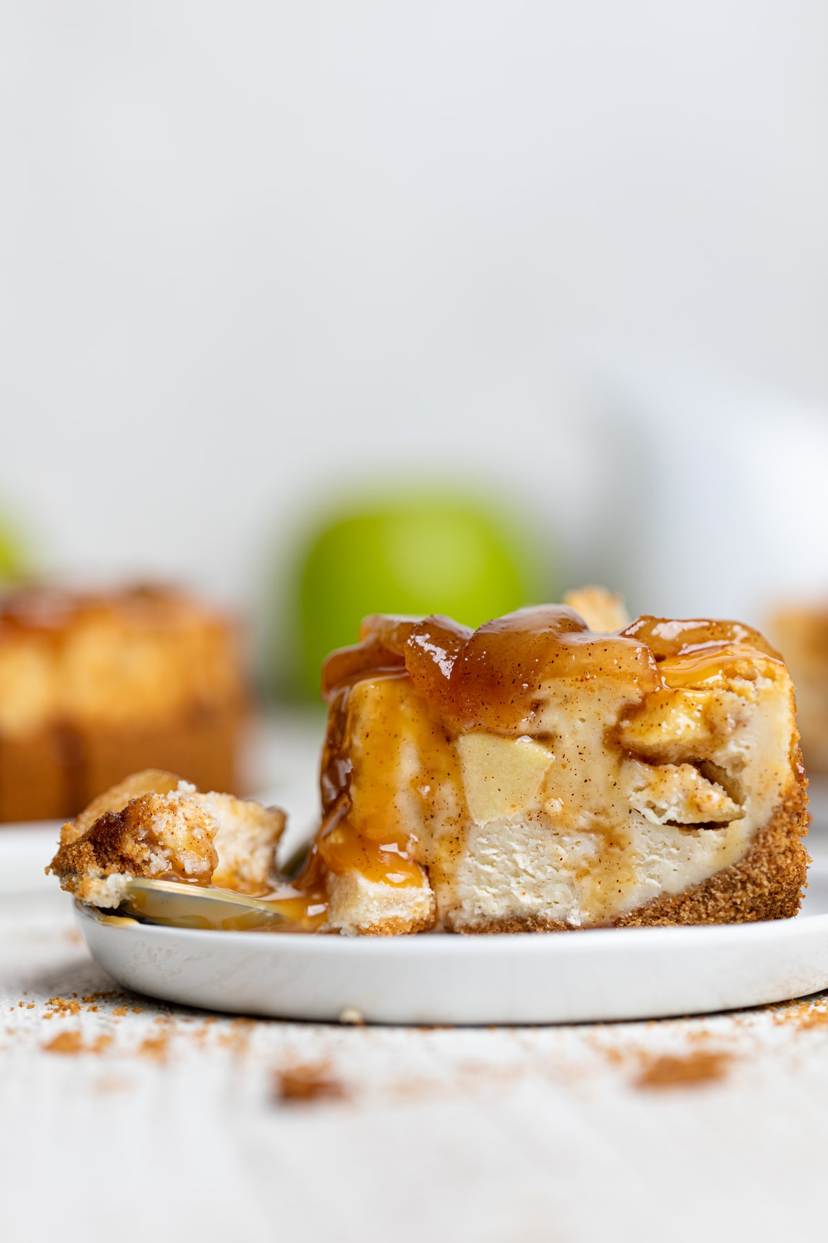 Slice of Caramel Apple Spice Cheesecake with the end cut off.