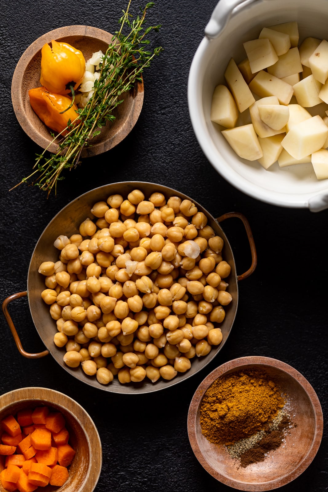 Ingredients for this easy weeknight meal including thyme, carrots, and peppers