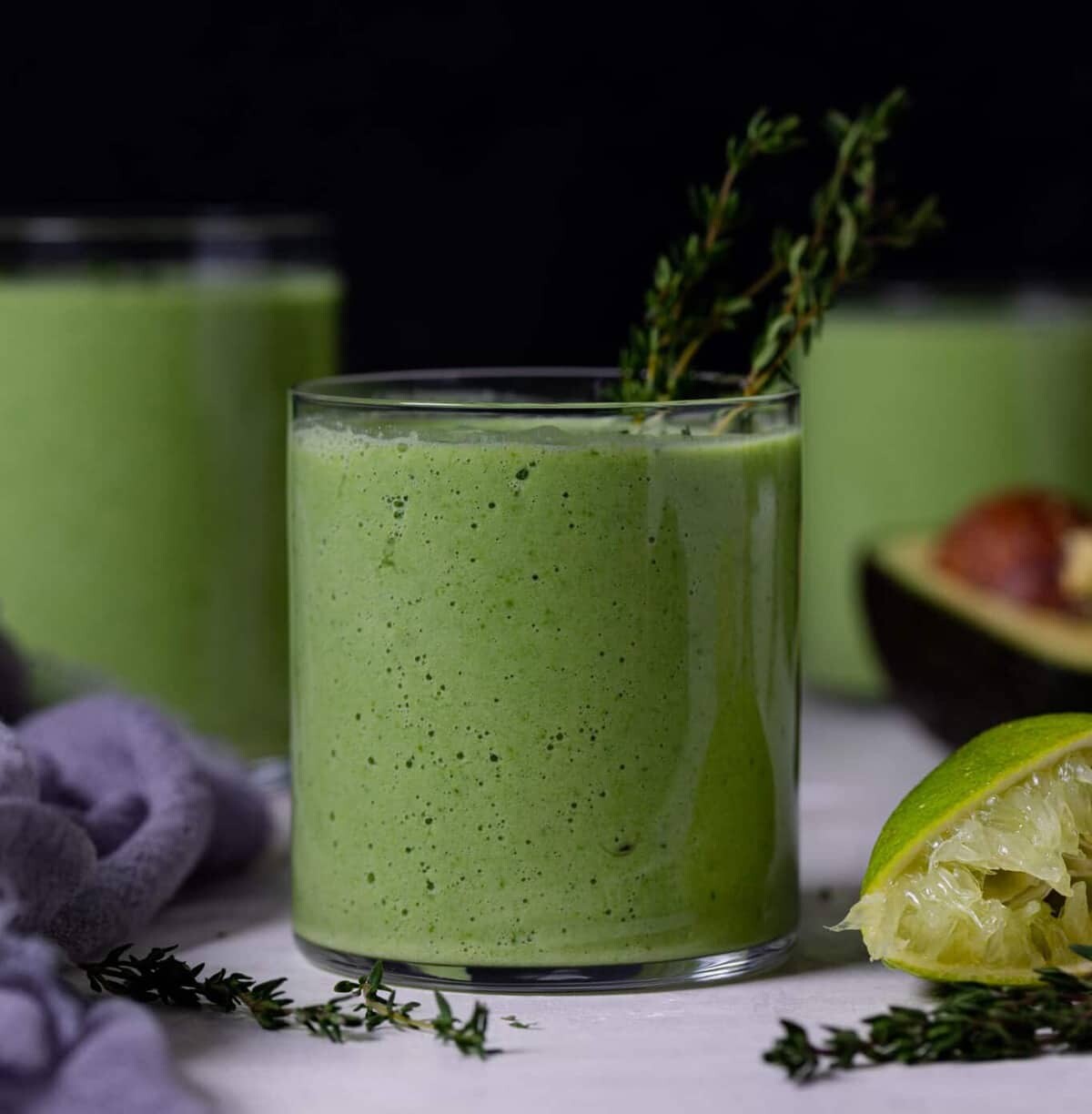 Small glasses filled with Super Green Detox Smoothie.