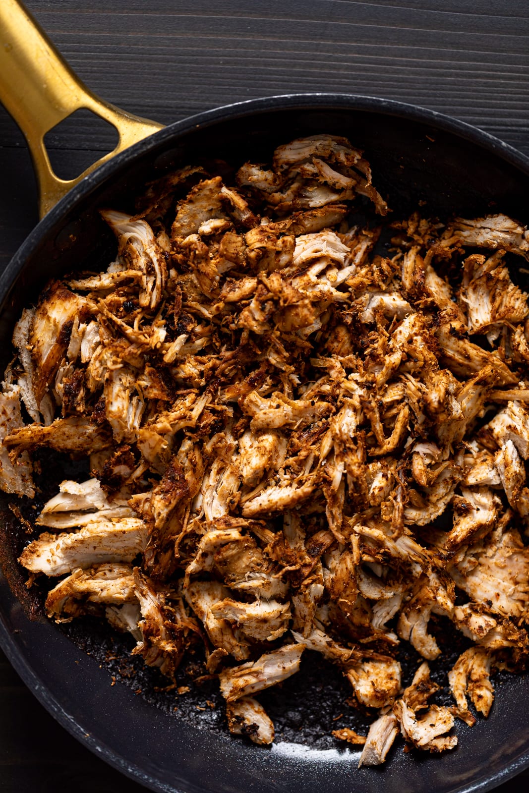 Skillet of shredded jerk chicken