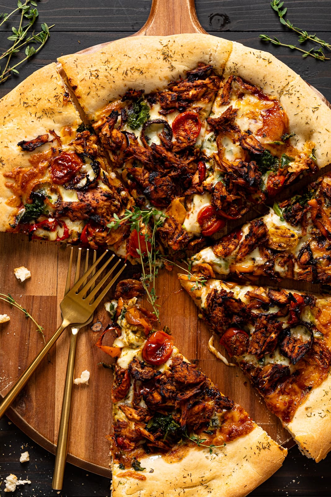 Sliced Jamaican Jerk Chicken Pizza missing some slices