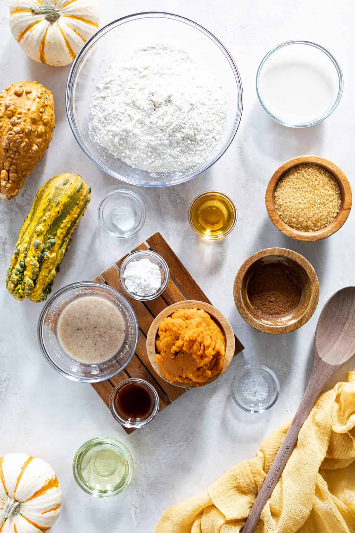 Ingredients for Vegan Pumpkin Bread including flour, pumpkin, and brown sugar.