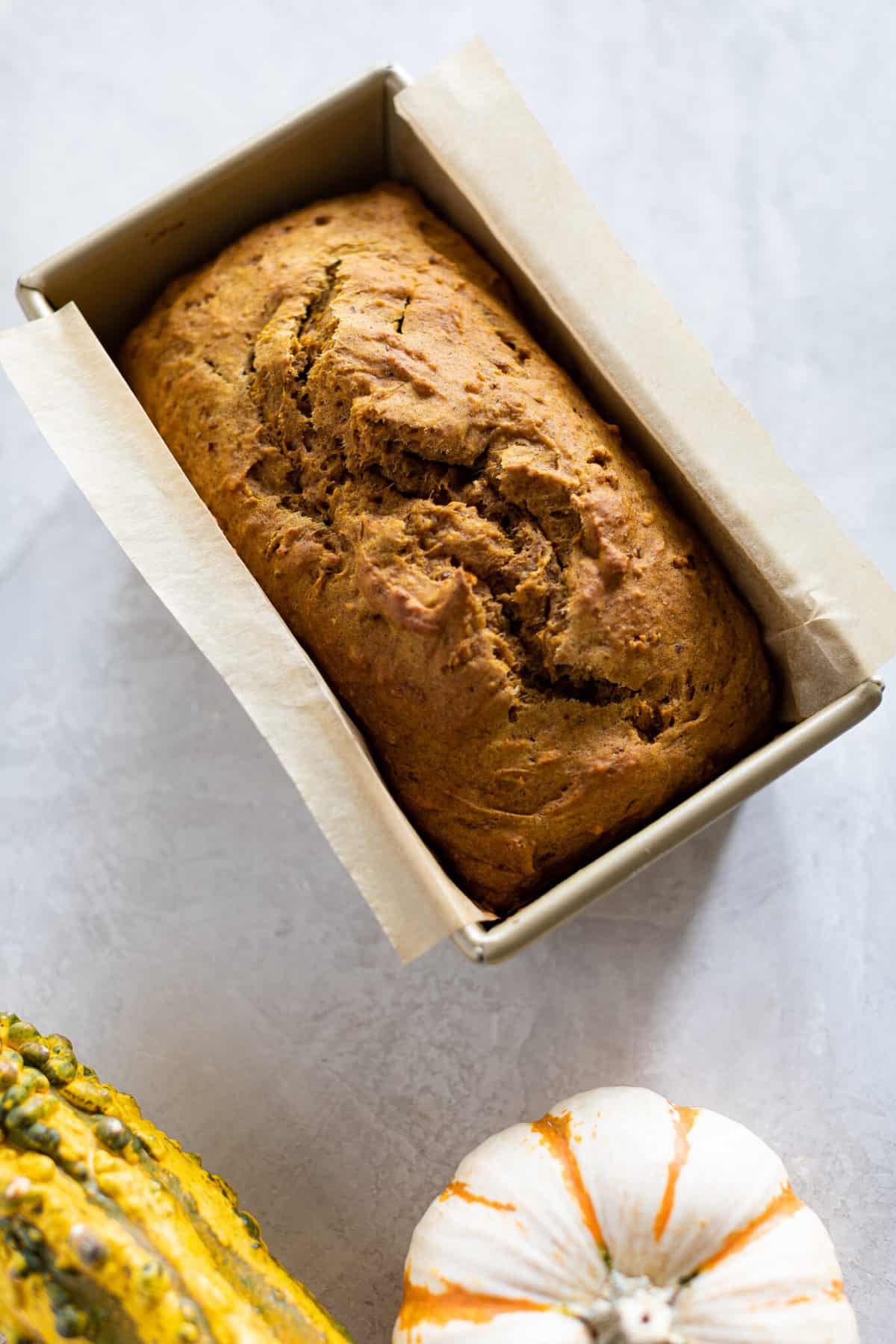 Loaf of Vegan Pumpkin Bread in a bread pan.