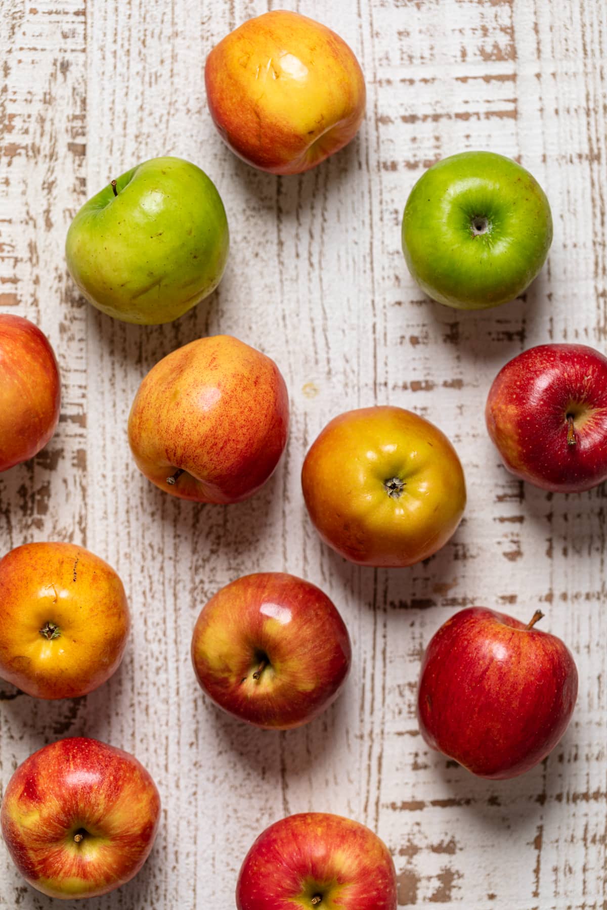 Different colored apples on a table