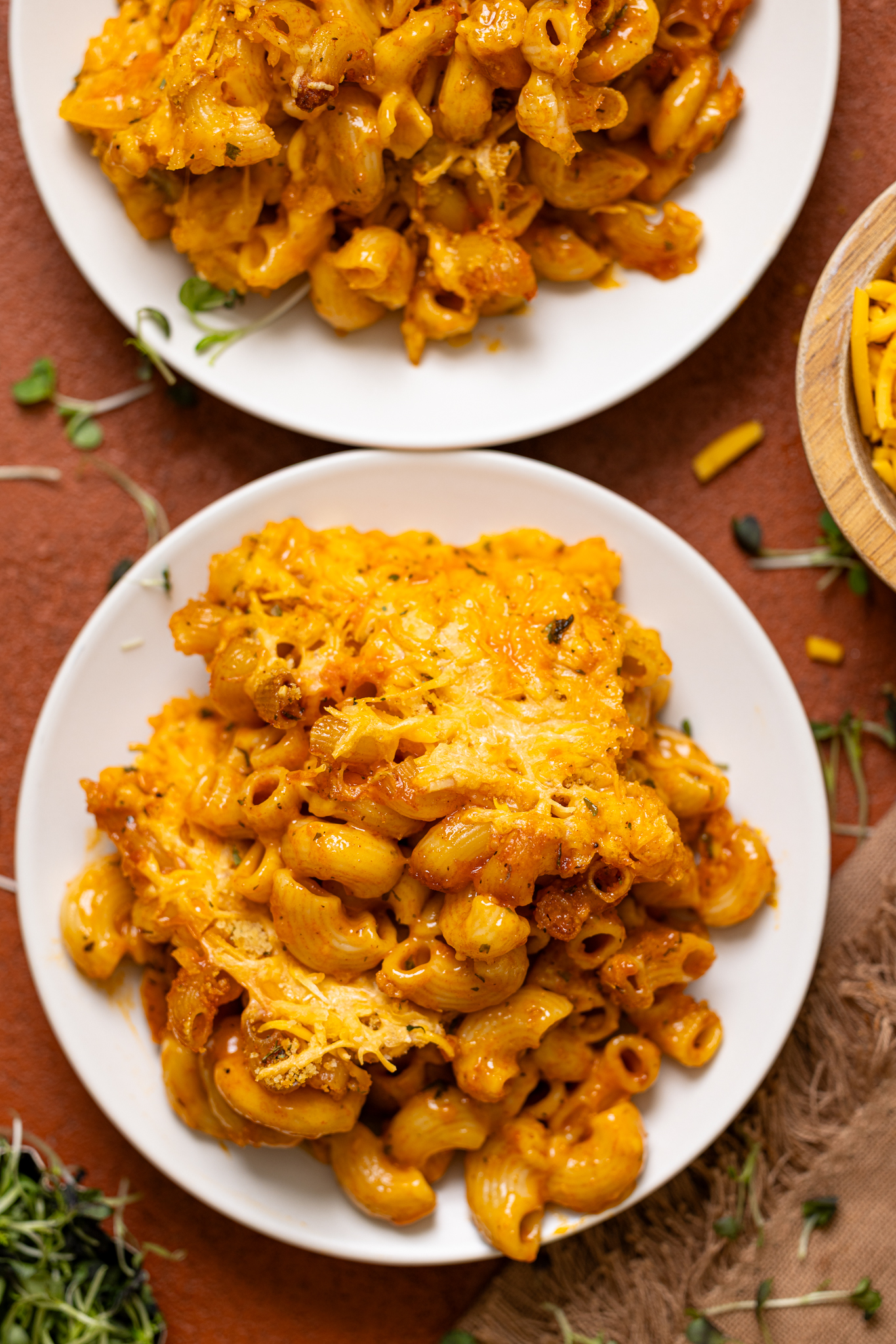 Baked Vegan Buffalo Mac + Cheese on plates.