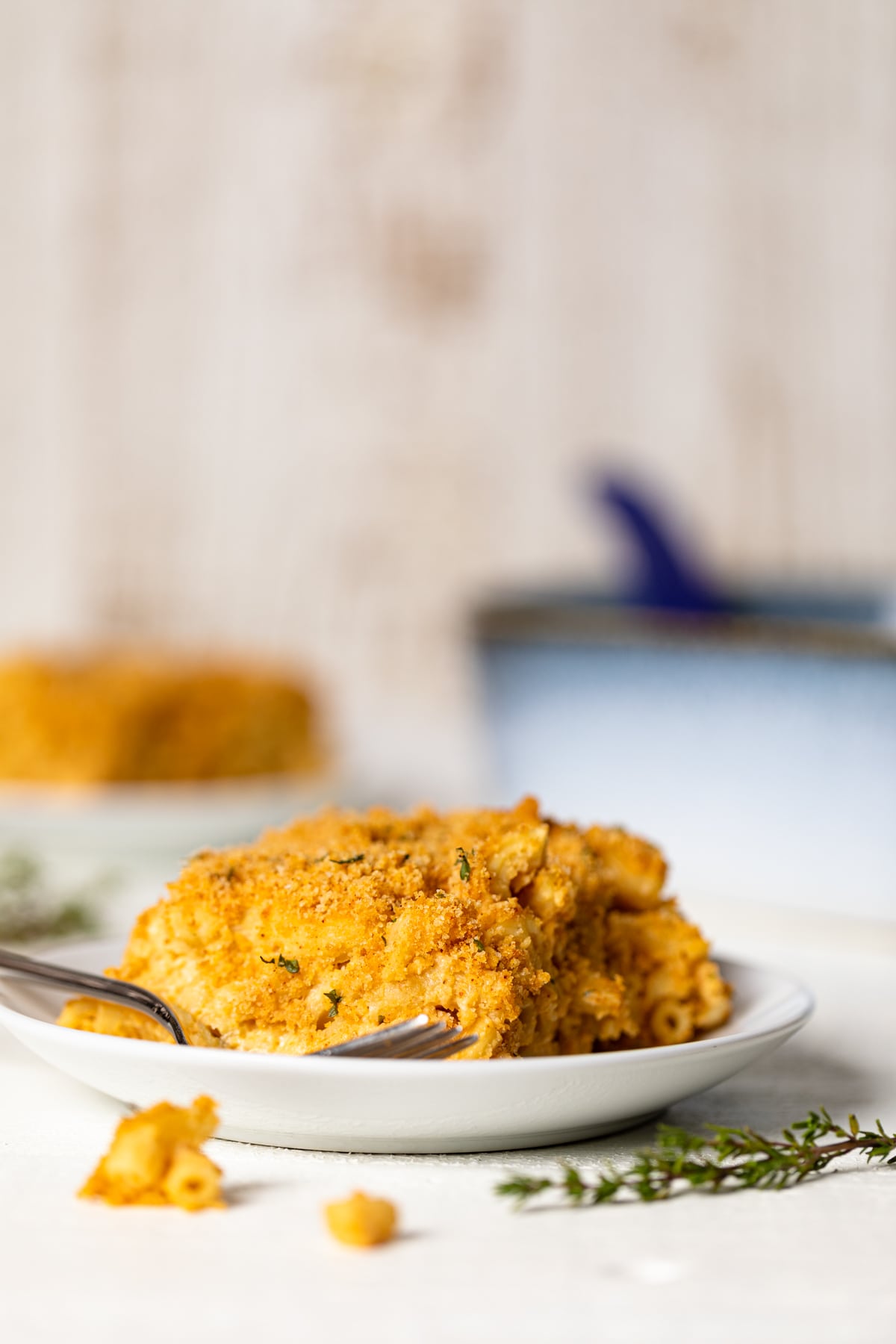 Baked Vegan Buffalo Mac and Cheese on a plate with a fork.