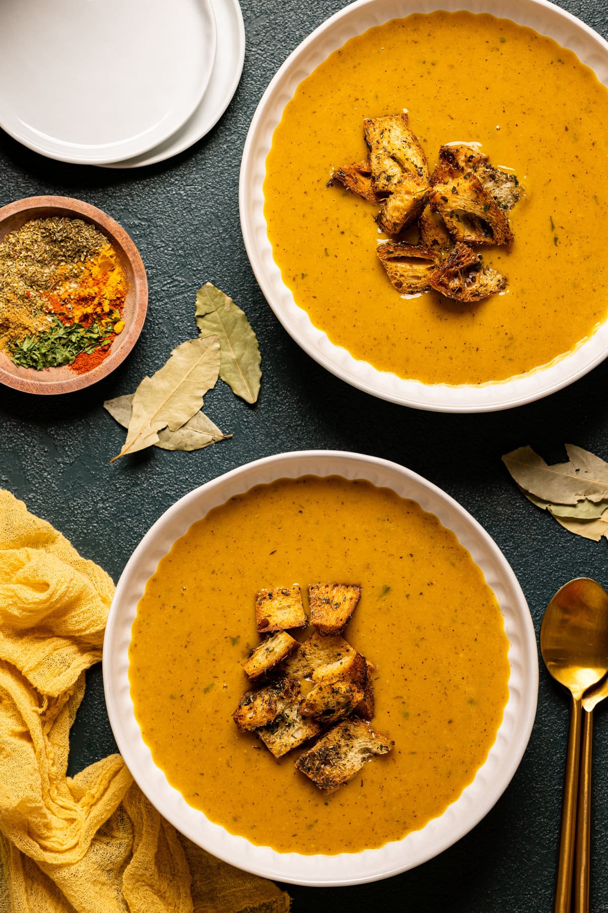 Overhead shot of two bowls of Roasted Butternut Squash Soup