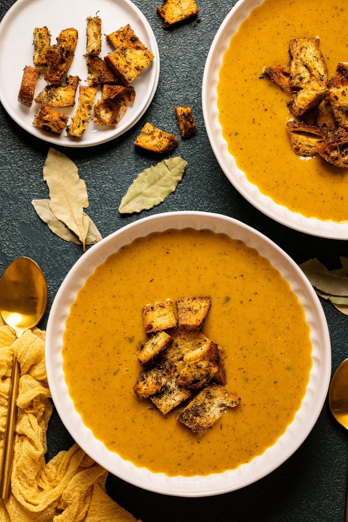 Overhead shot of two bowls of Roasted Butternut Squash Soup