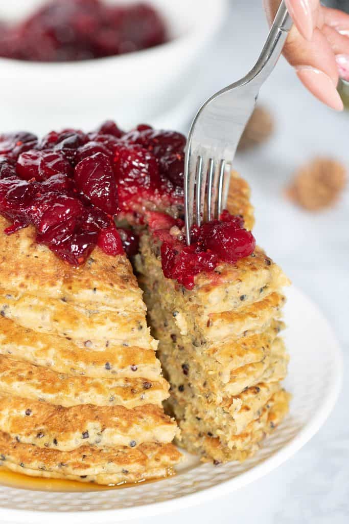 Fork grabbing some Vegan Quinoa Pancakes with Cranberries.