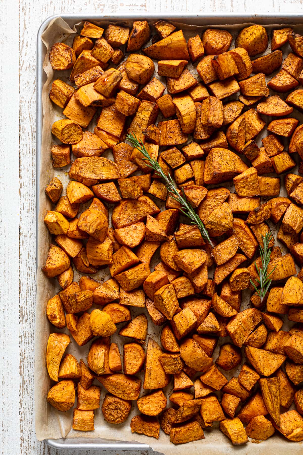 Roasted Sweet Potato chunks on a baking sheet