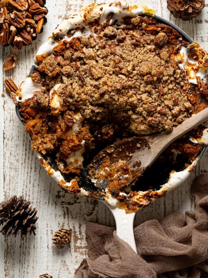 Wooden spoon serving Vegan Skillet Sweet Potato Casserole