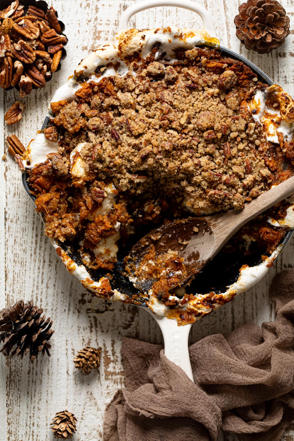 Wooden spoon serving Vegan Skillet Sweet Potato Casserole