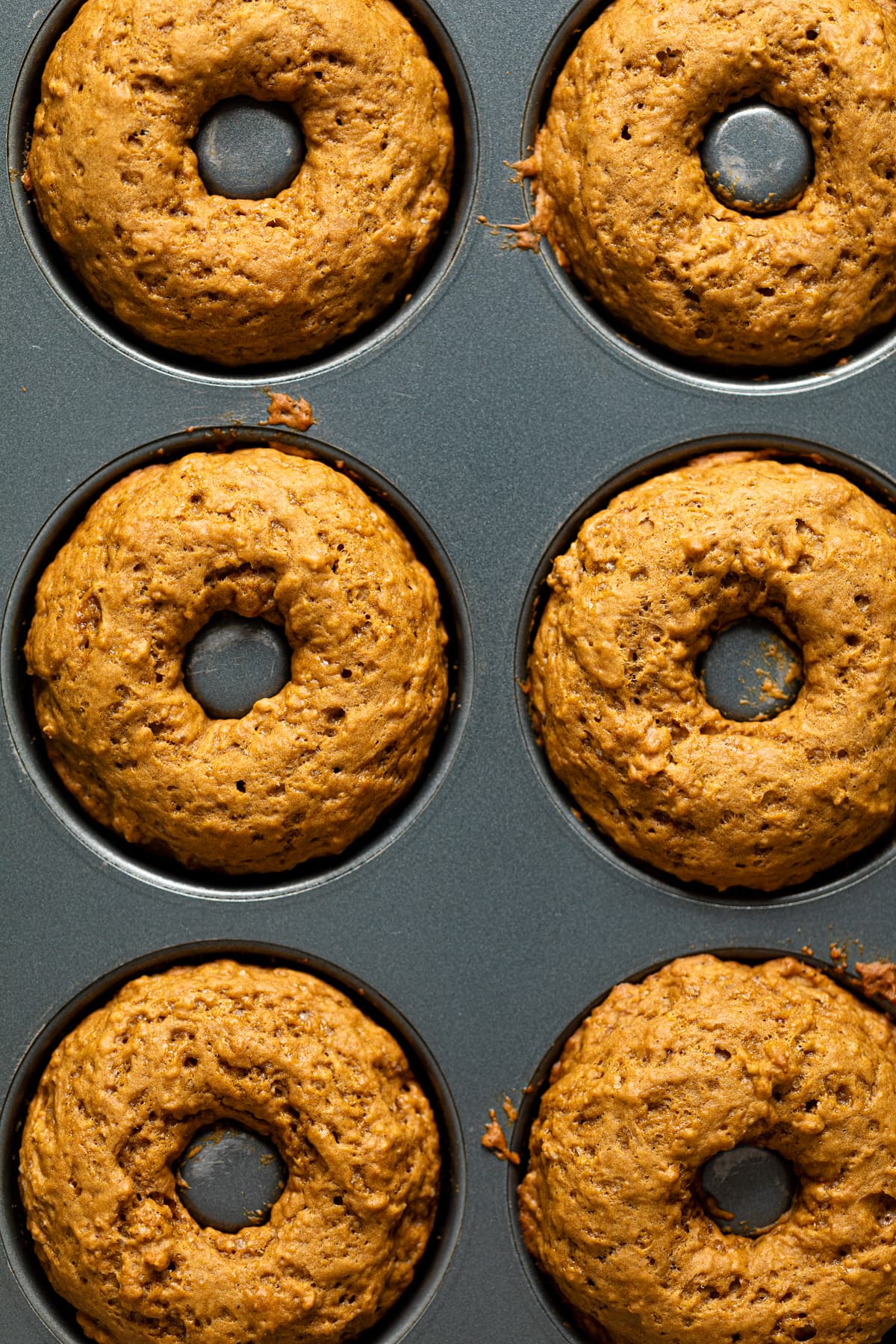 Vegan Gingerbread Donuts in a donut pan.