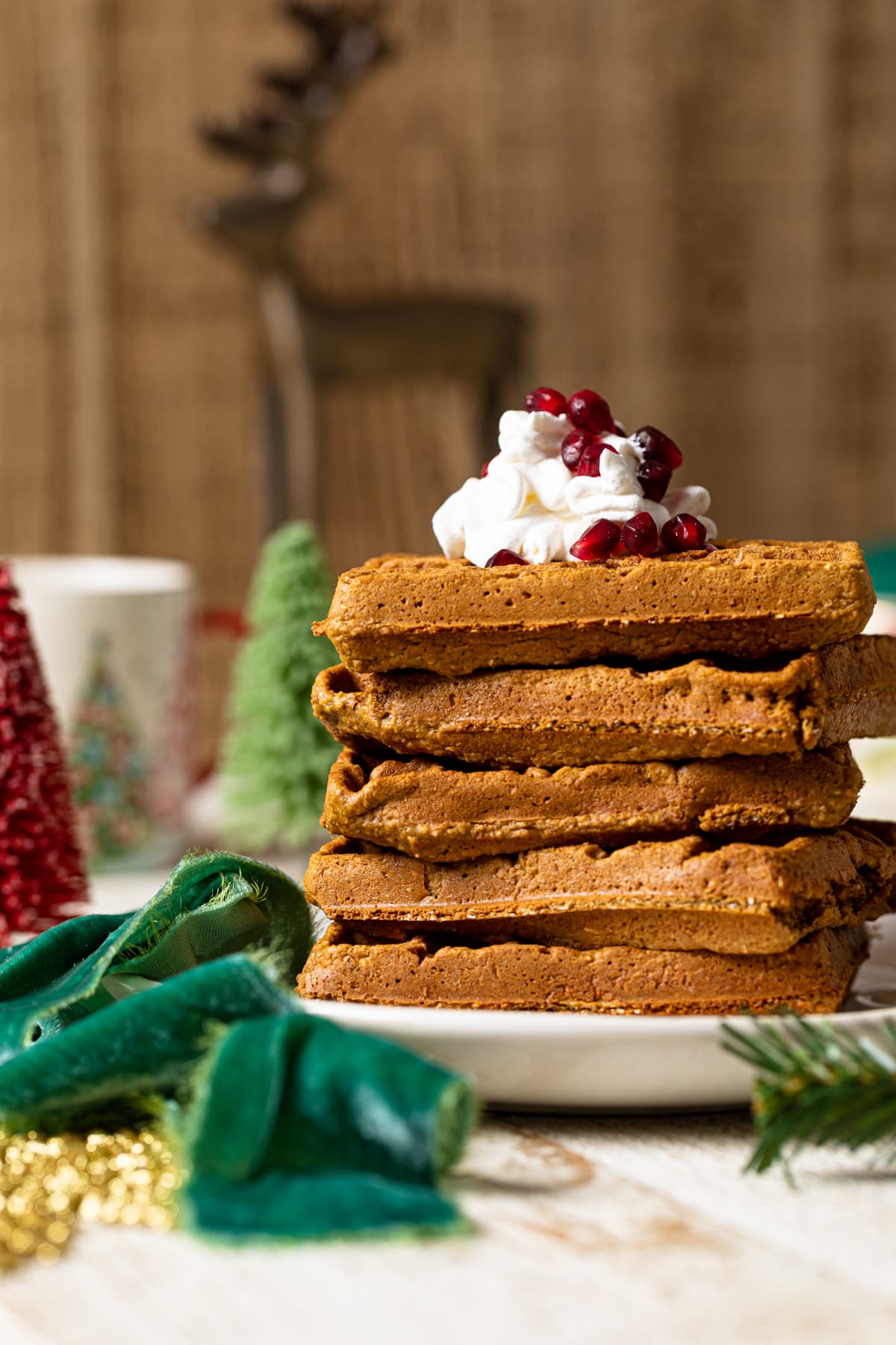 Stack of Gluten-free Flourless Gingerbread Waffles on a plate.