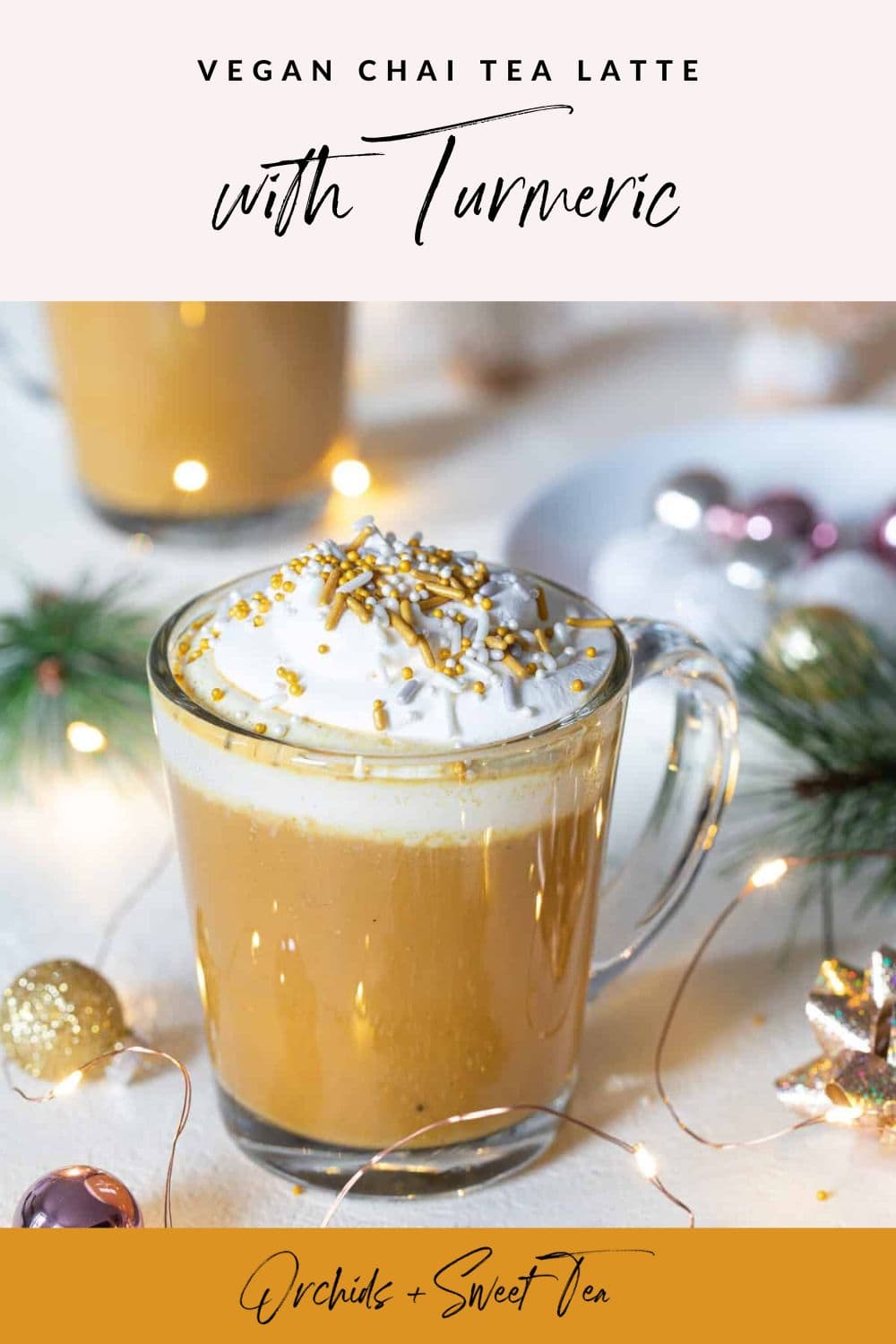 Golden milk tea in two glasses with Christmas decor and ornaments. 